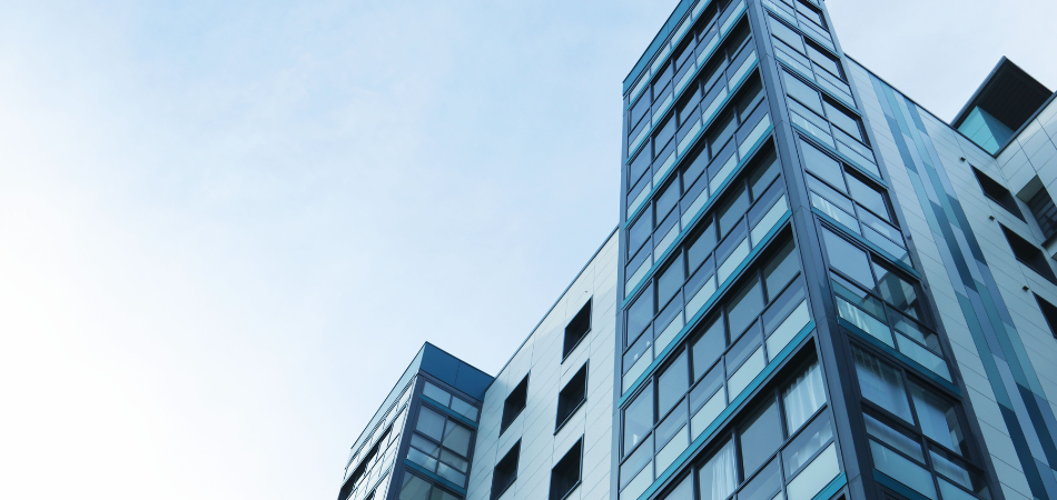image of corporate building with a blue sky, representing the innovative and modern approach of Smart ECP by Inventors Technologies.